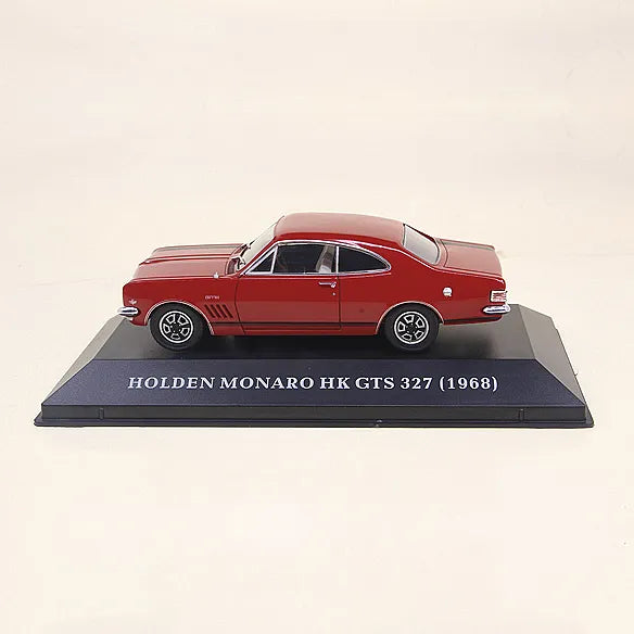 a model of a red car on a black base