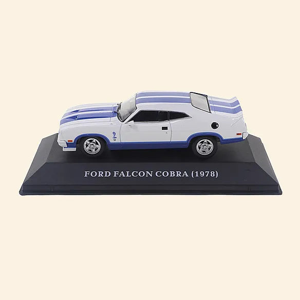 a model of a white car with blue stripes