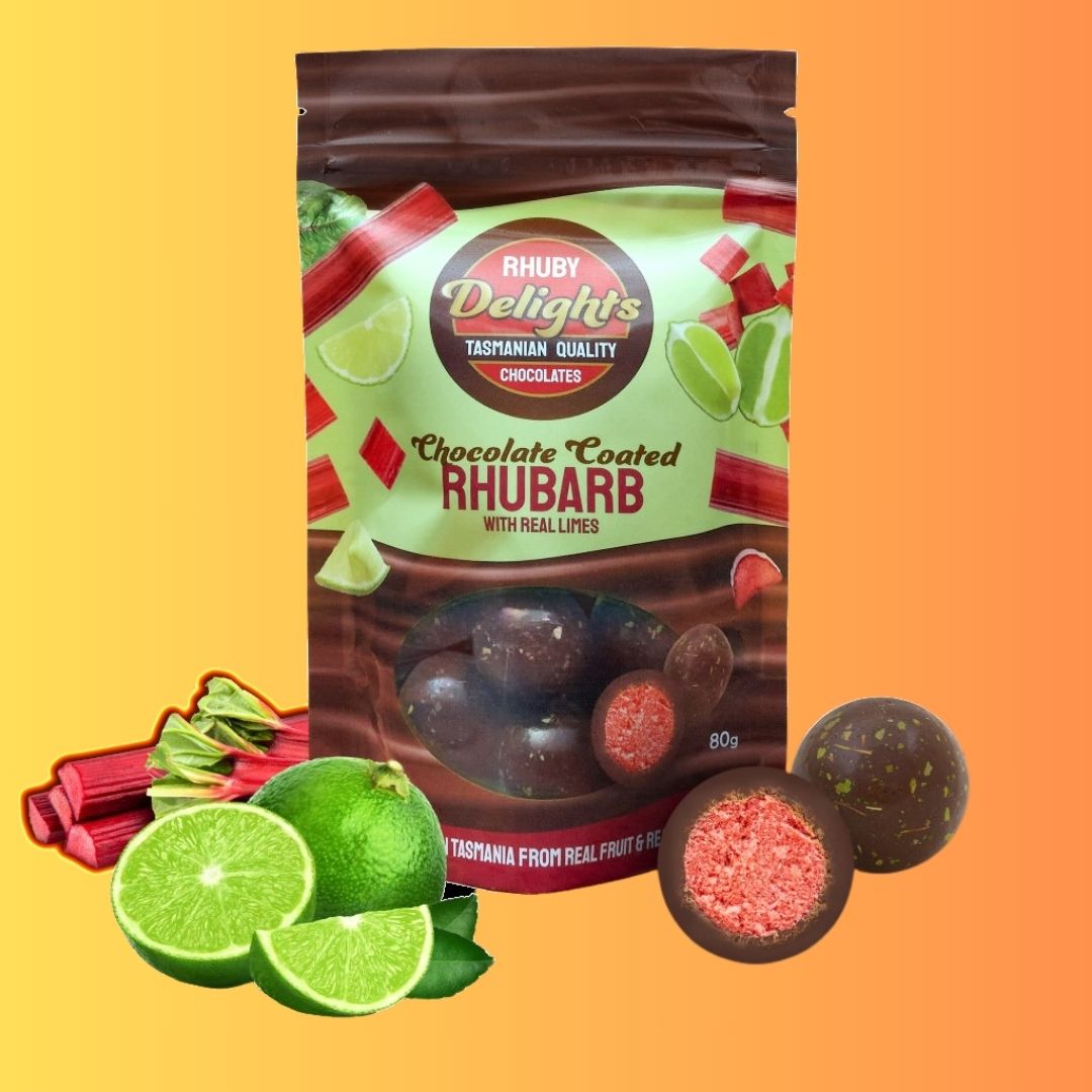 a bag of chocolate covered fruit next to limes